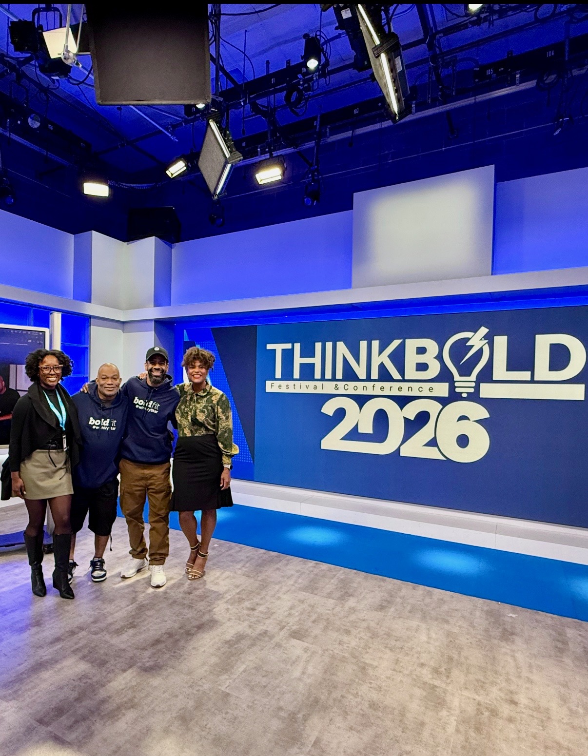Troy and Mo with guests inside the ThinkBold 2026 television studio set